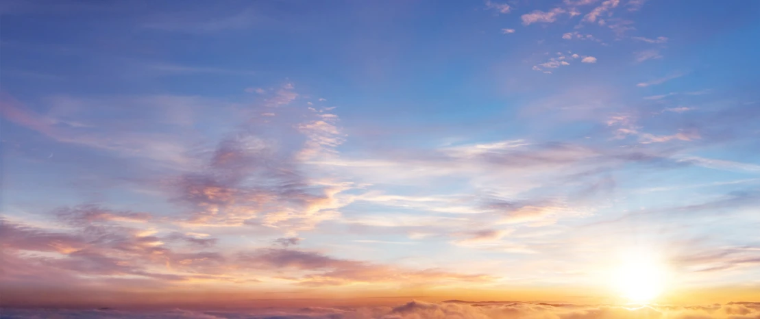Colorful sunset sky with wispy clouds
