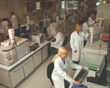 Researchers analyzing data in lab