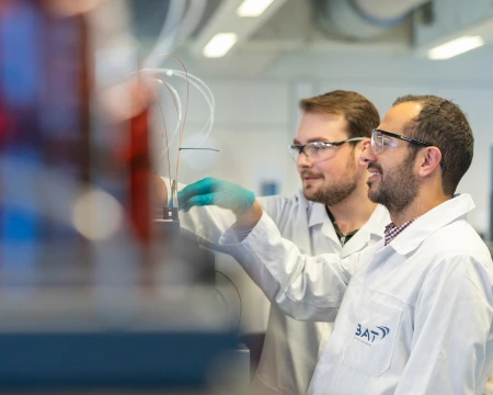 Scientists examining lab sample