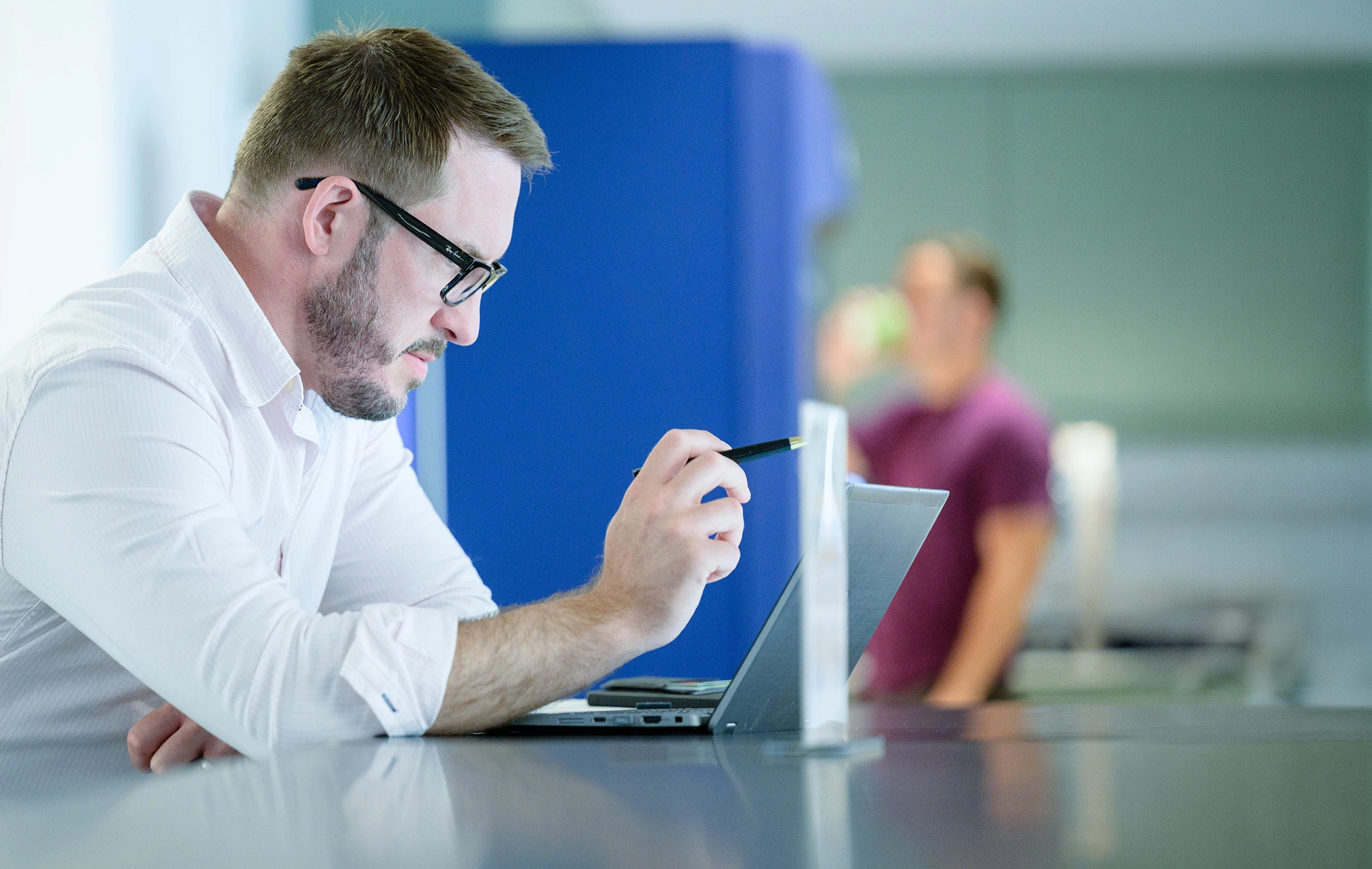 Man working on laptop in an office
