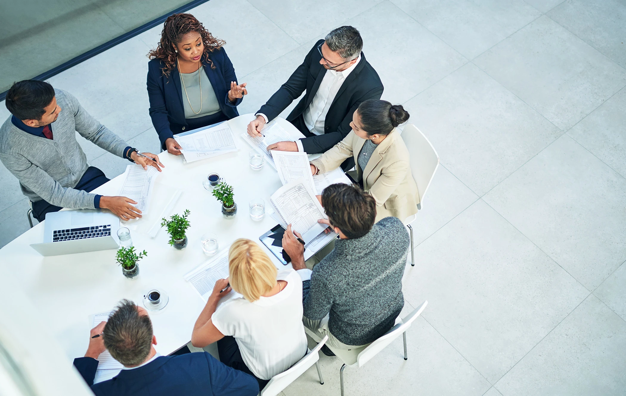 People sitting around a table in a meeting