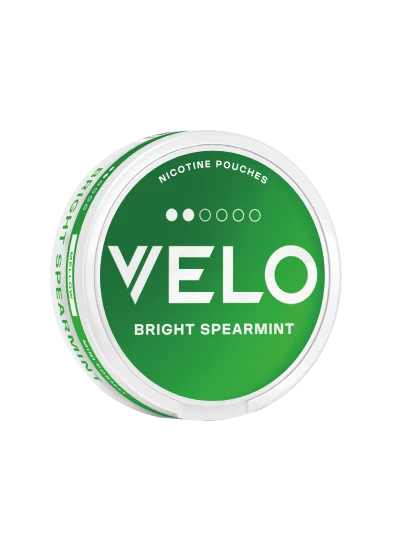 Close-up of nicotine products: a green Velo pouch container labeled 'Bright Spearmint'