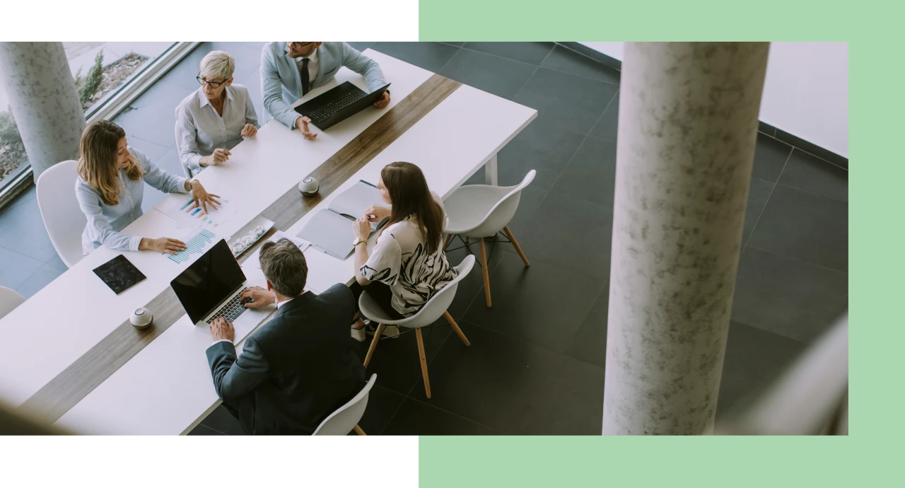 Business meeting with people around table
